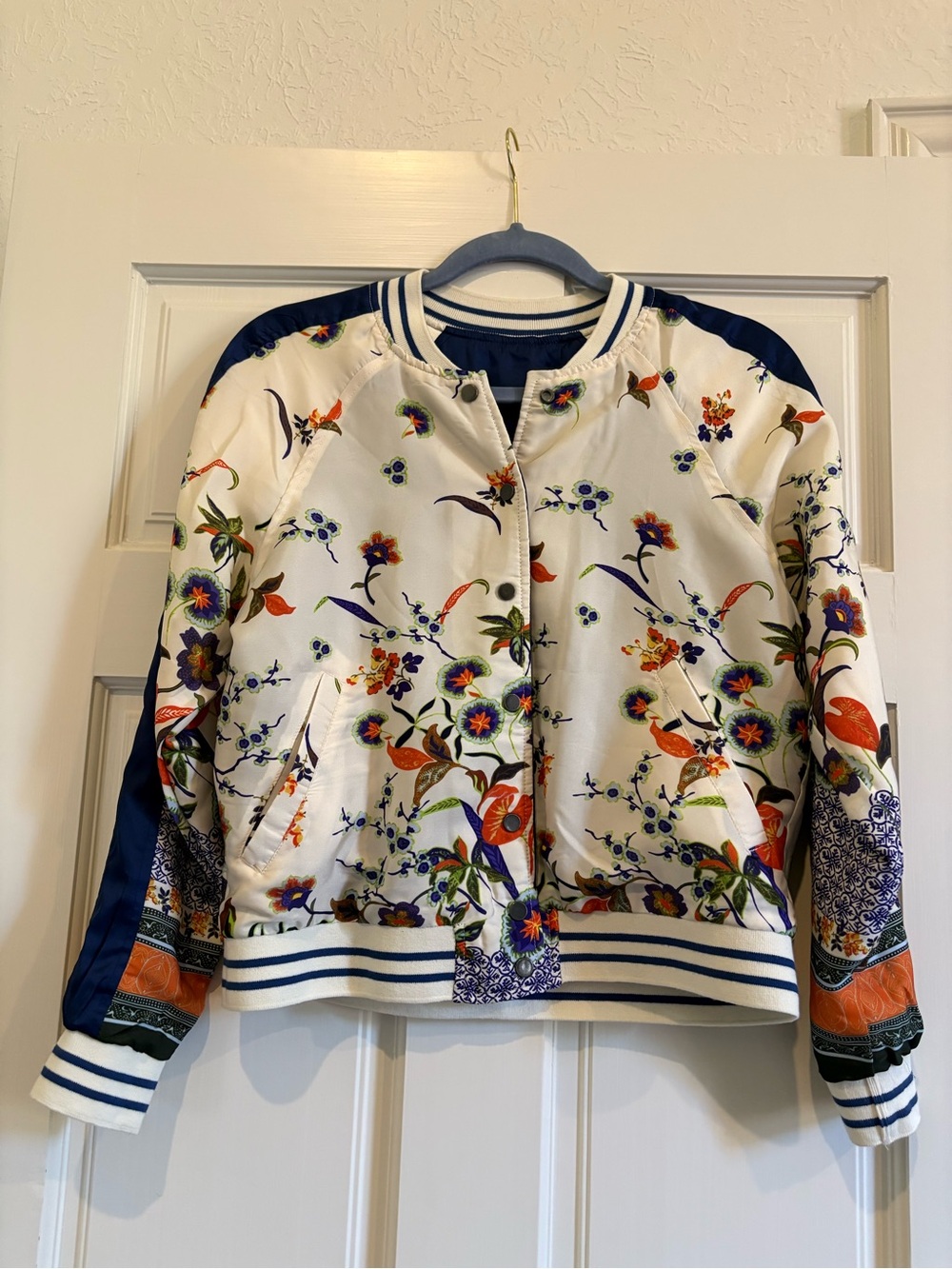 Floral Satin Bomber Jacket in Ivory with Navy Accents
Reversible